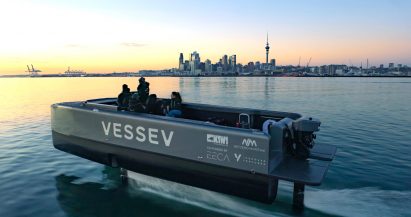 Vessev V-9 hydrofoil ferry captured via drone in front of the Auckland skyline