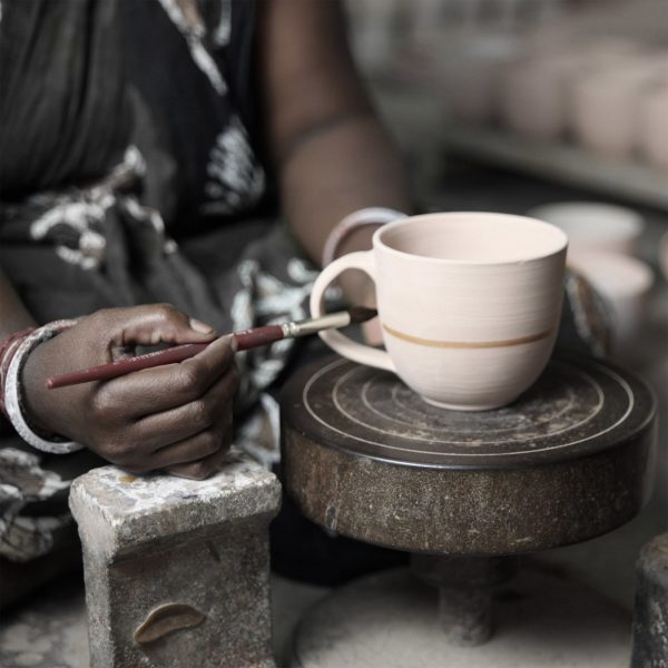 Photo of person crafting a mug