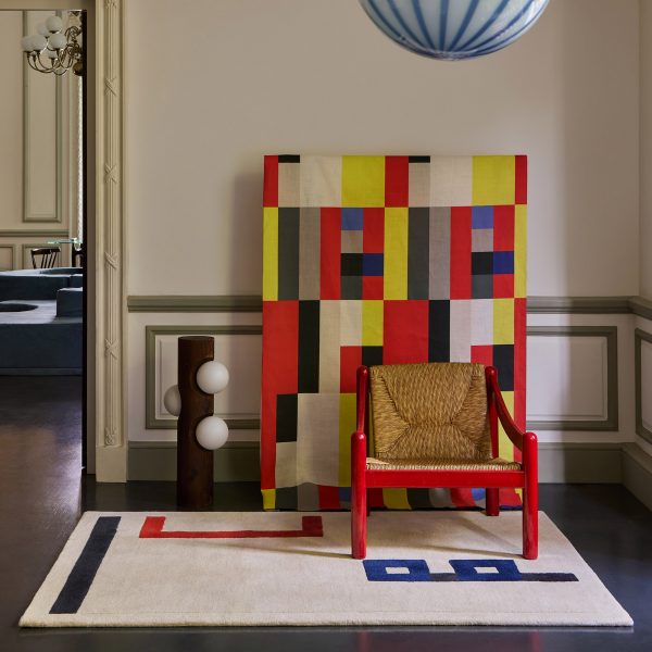 Photo of rug by Christopher Farr with other colourful furniture