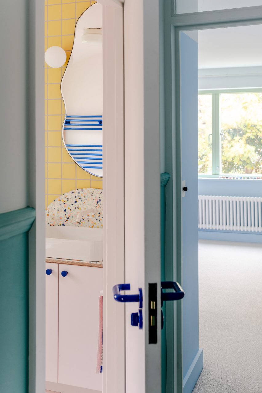 Bathroom with pink and yellow tiles
