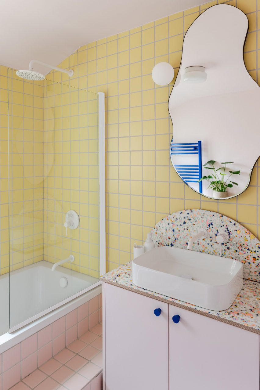 Bathroom with pink and yellow tiles