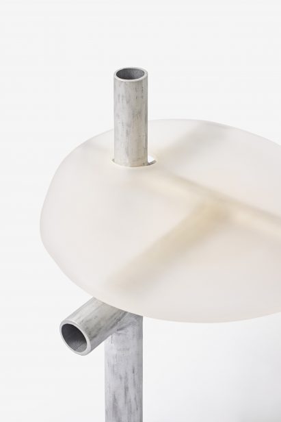 Close-up of metal and plastic furniture by Jeonghwa Seo on white backdrop