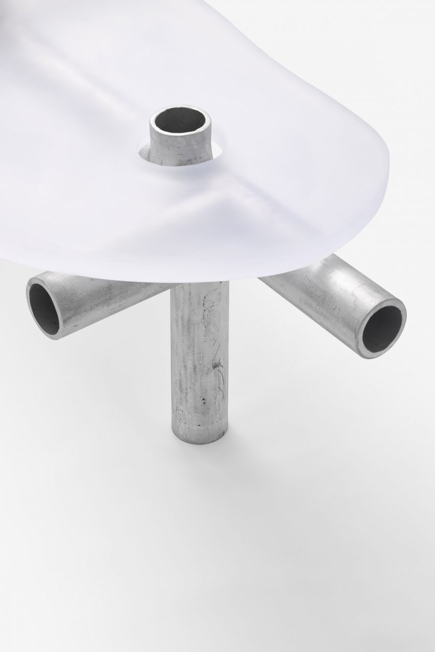 Metal and plastic item of furniture on white backdrop