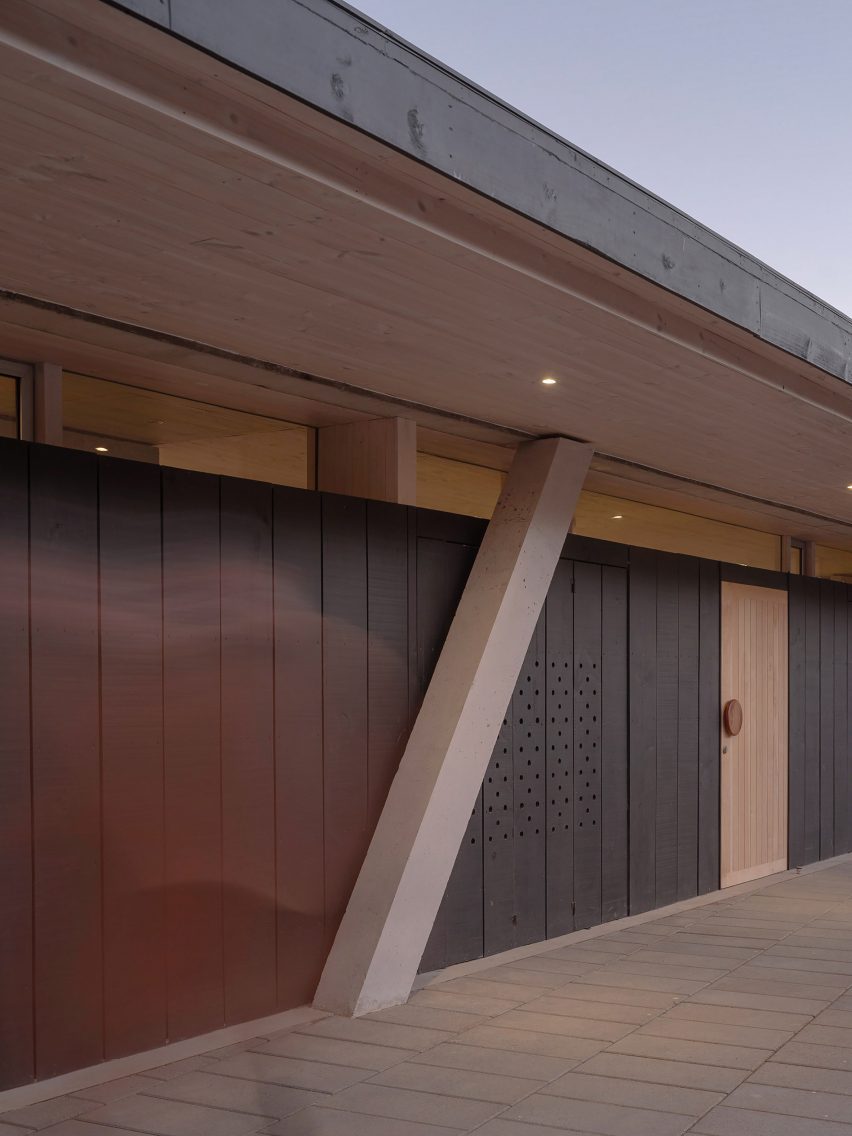 Columns supporting black clad house