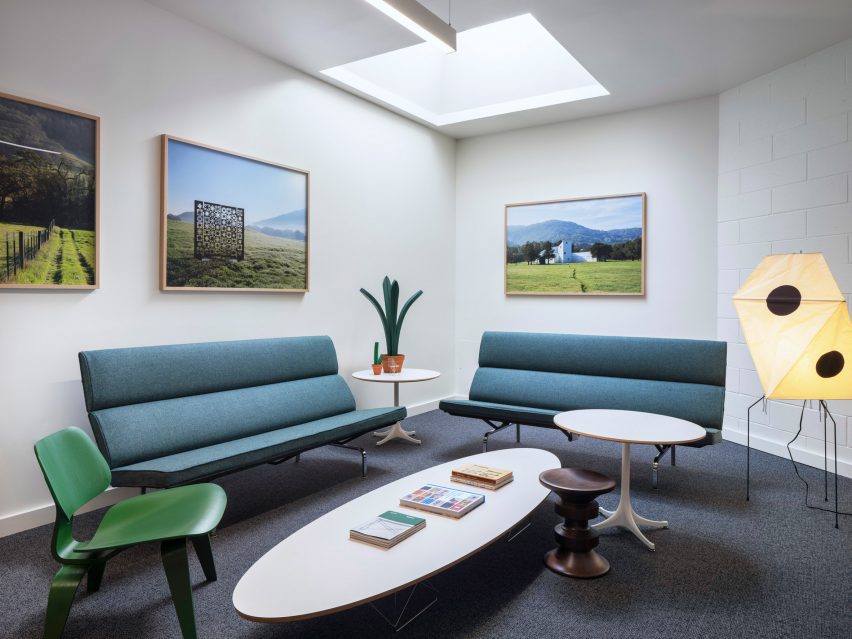Blue couch with paintings