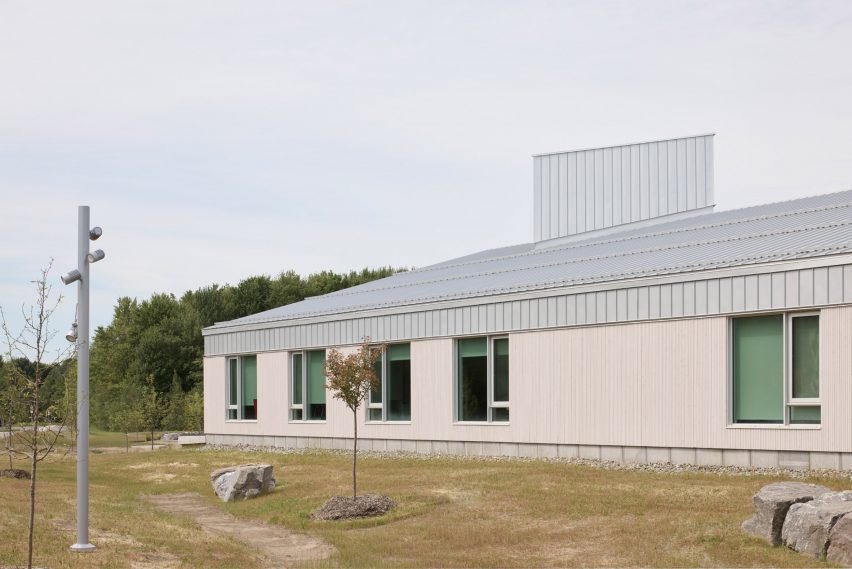 School building with light coloured siding