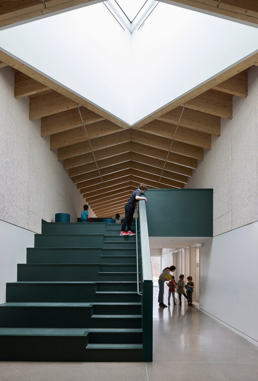 Wood ceiling and dark green stairs