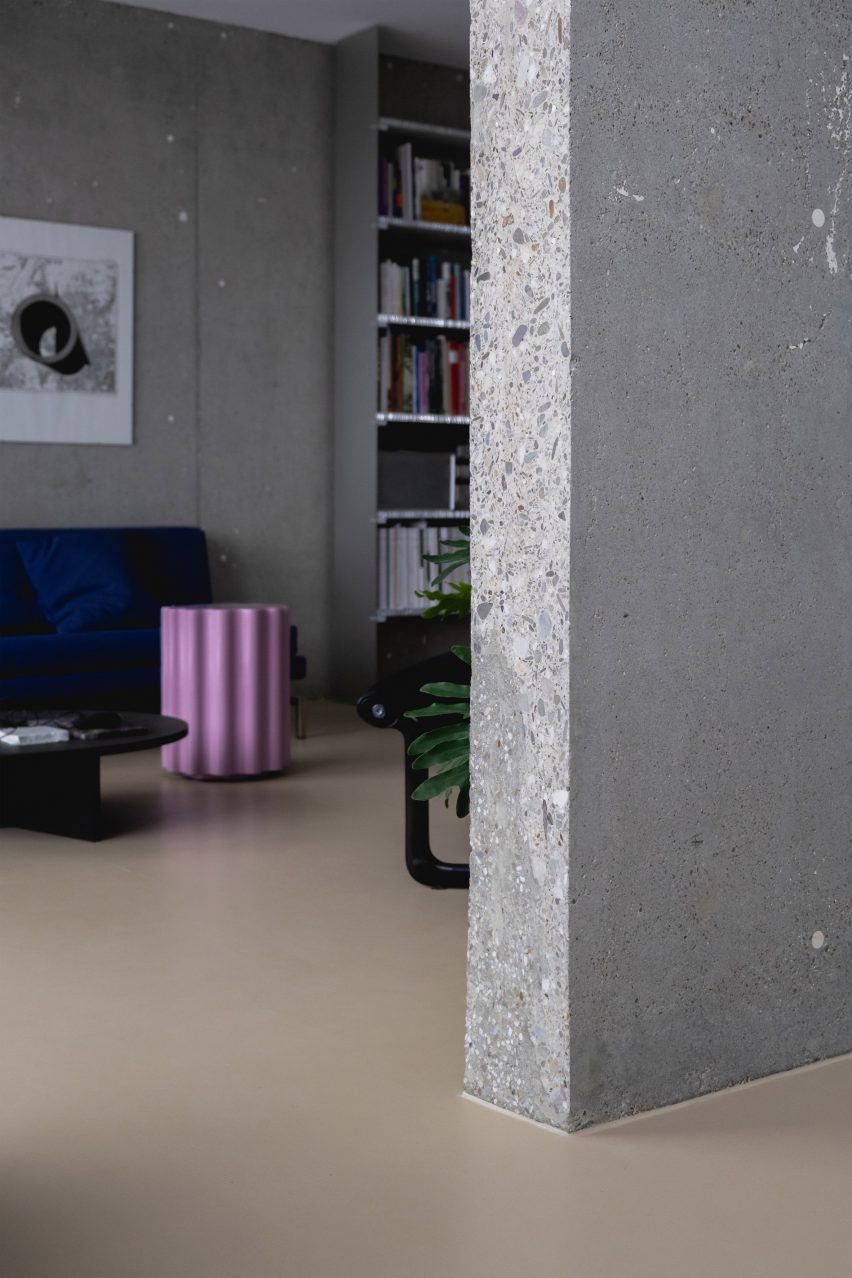 View past concrete wall looking into living area