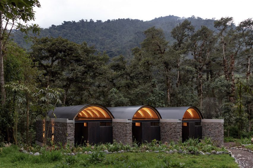 A series of stone buildings in jungle