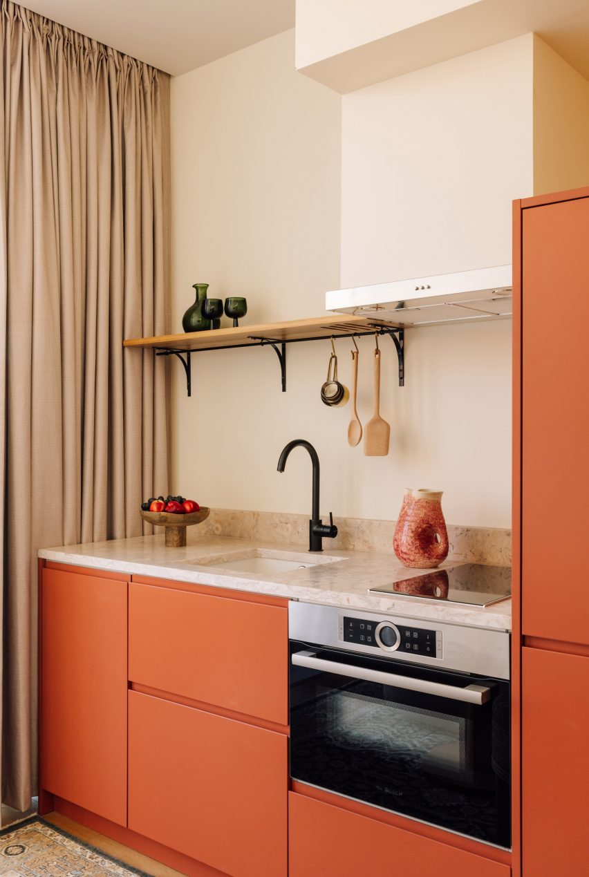 Orange kitchenette in rooms by Post Company