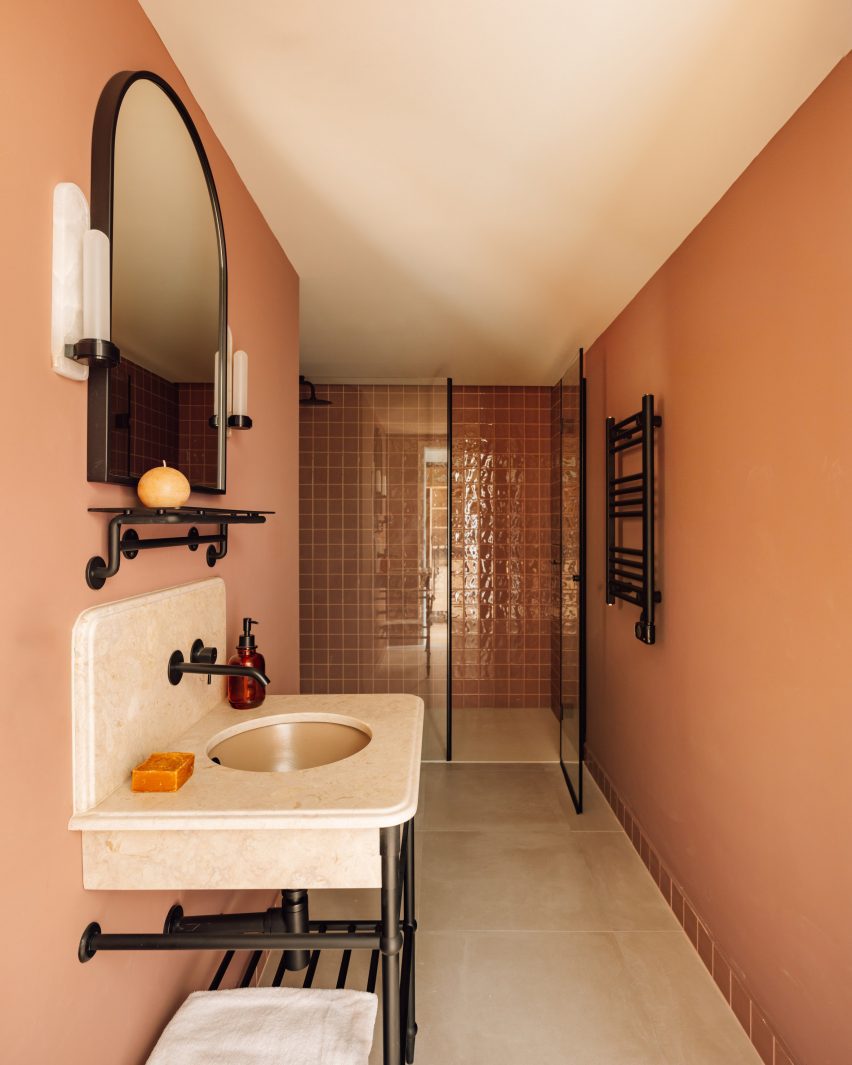 Earthy pink walls and Portuguese stone in bathroom Locke hotel