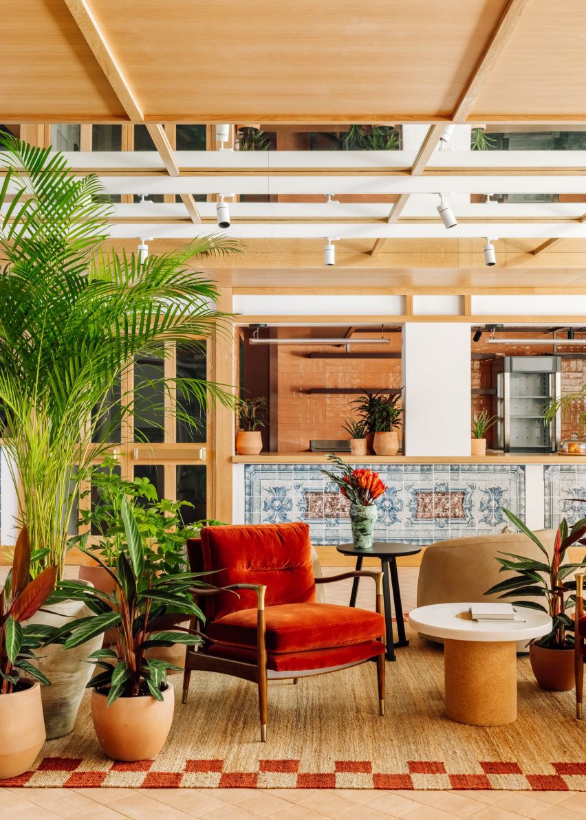 Bright orange chair and oversized pots