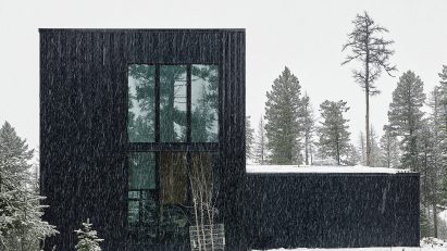 Black house in the snow