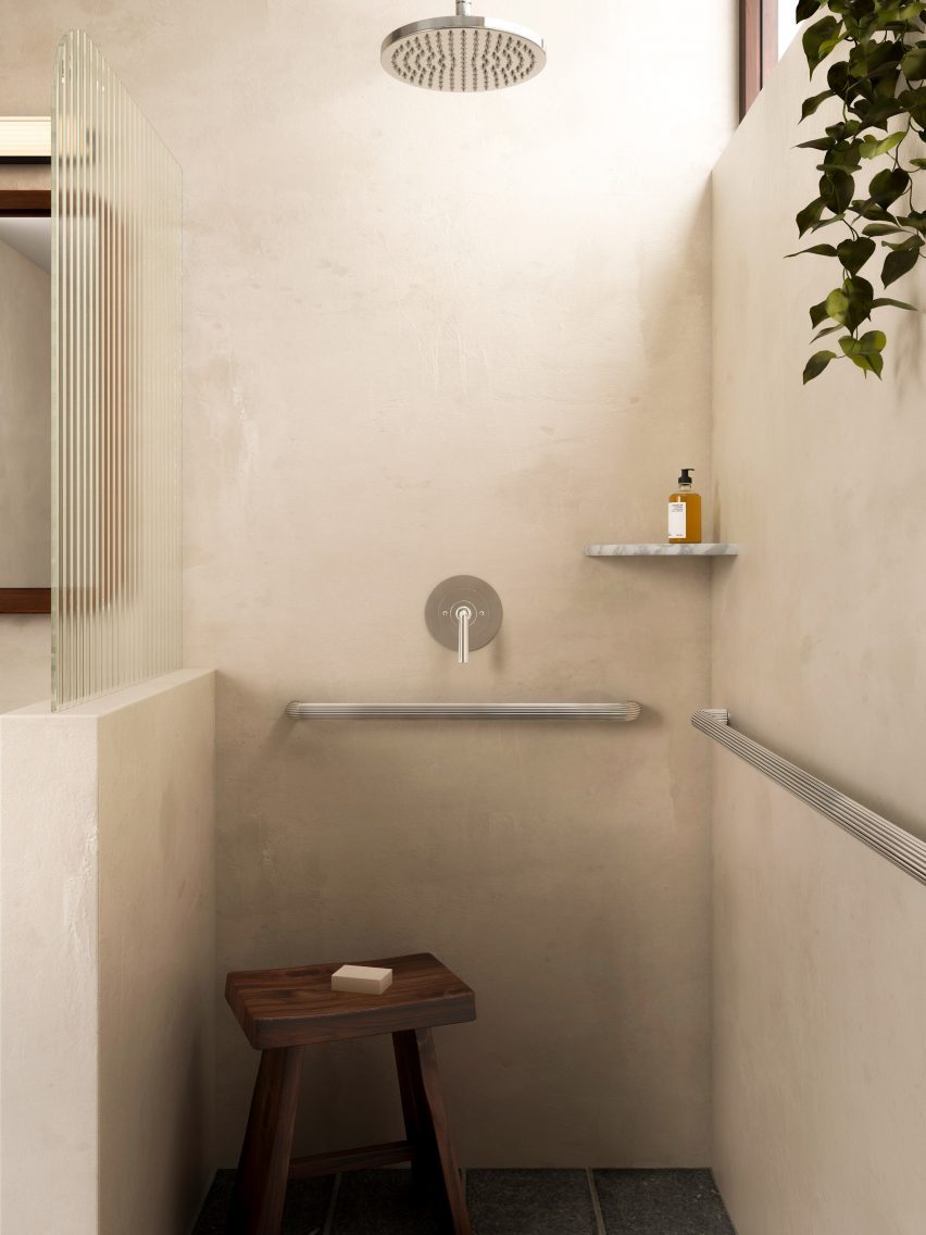 Bathroom with metallic grab bar