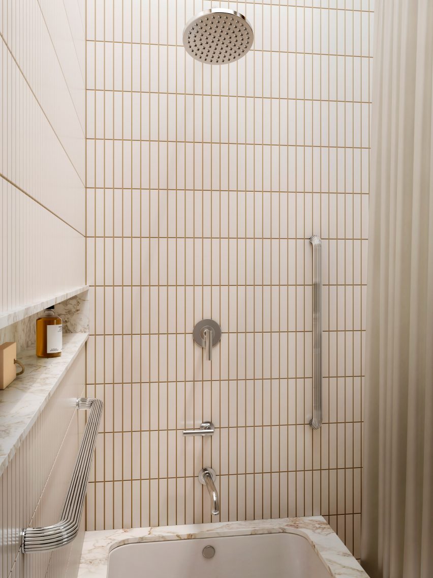 Bathroom with metallic grab bar
