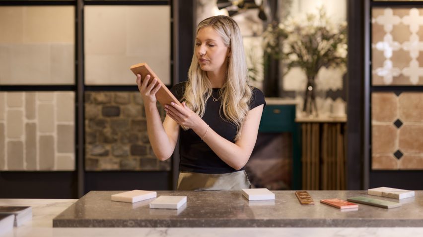 a photograph of a person holding tiles