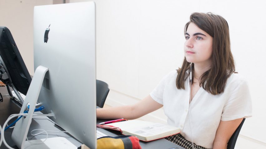 Person sitting at a desktop computer