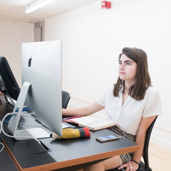 Person sitting at a desktop computer