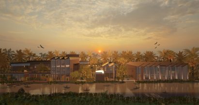 A visualisation of a recycling site on the water, against a sunsetting sky in tones of orange and blue.