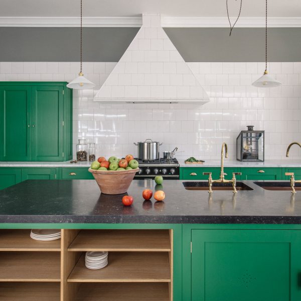 Photo of kitchen with green cupboards by Plain English