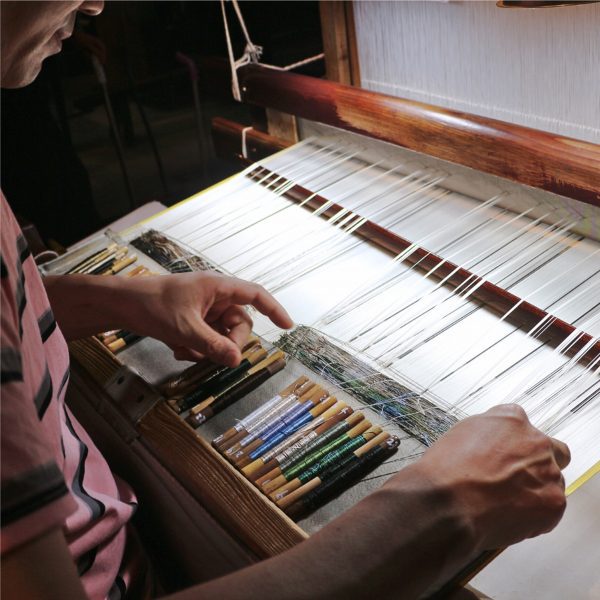 Photo of person weaving