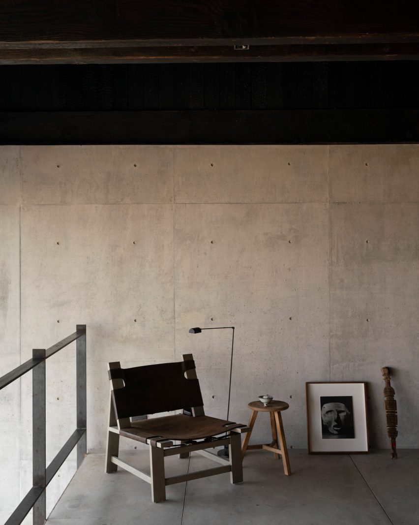 Concrete wall with black Mexican modern chair