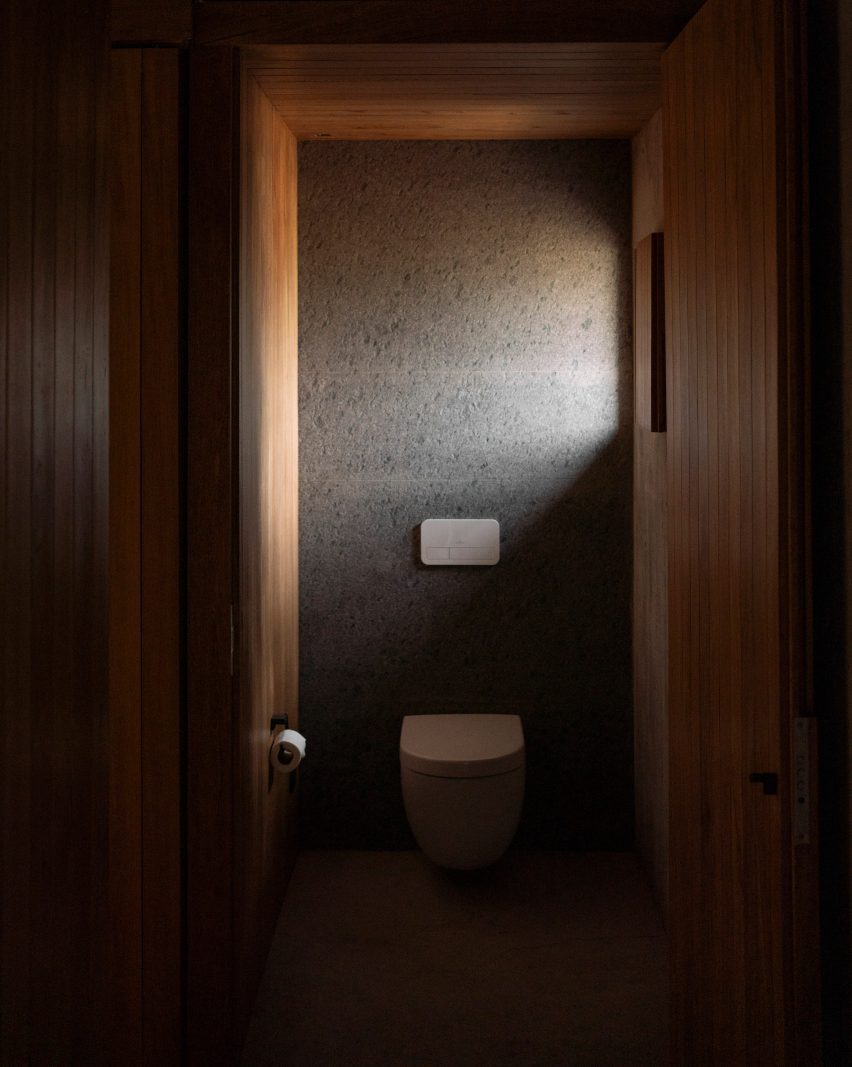 Darkly lit interior bathroom