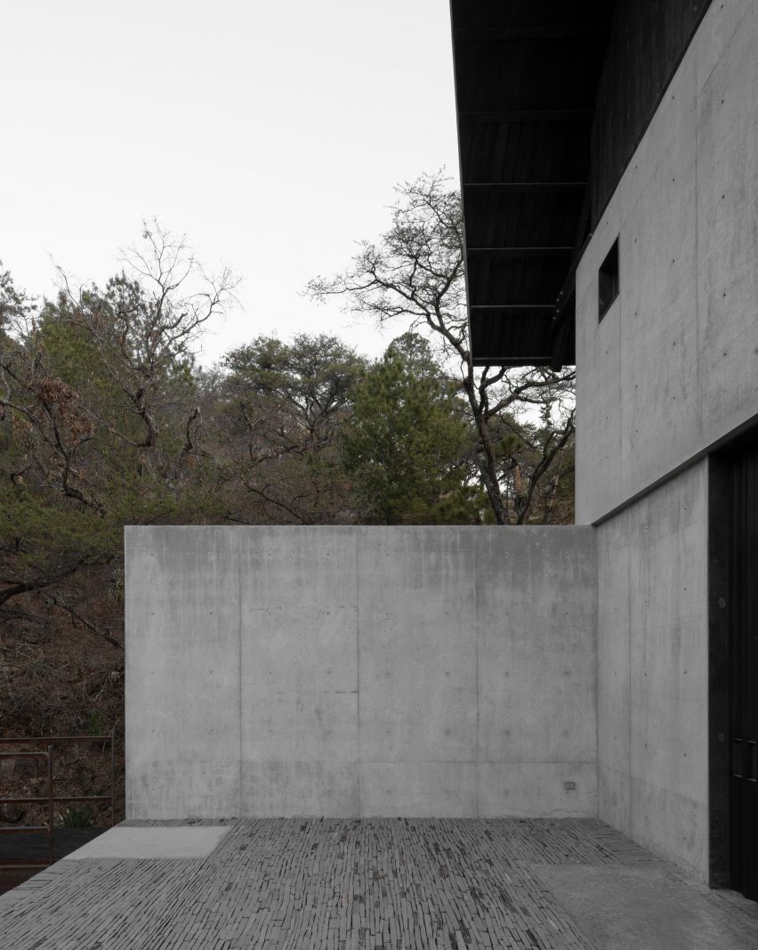 Concrete wall and black roof overhang