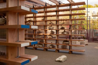 Rocks sitting on wooden shelves
