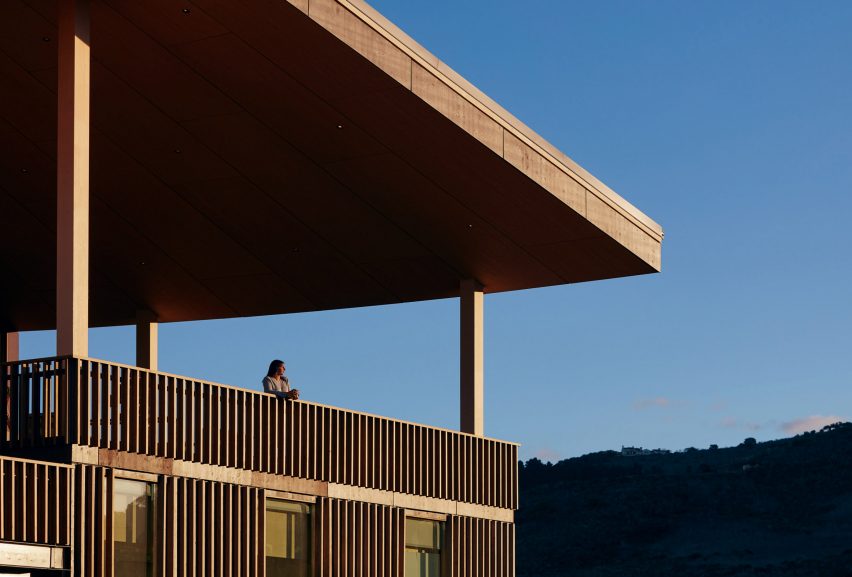 Person looking over balcony