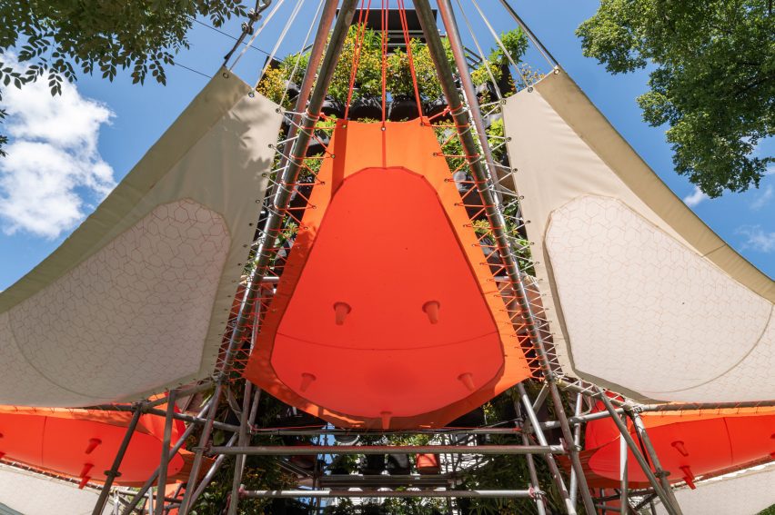 Tents protruding from columns of plants
