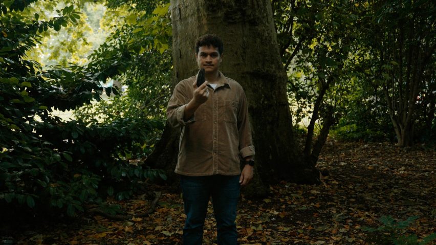 Photo of Richard Alexandre standing in a forest and holding the Pyri device