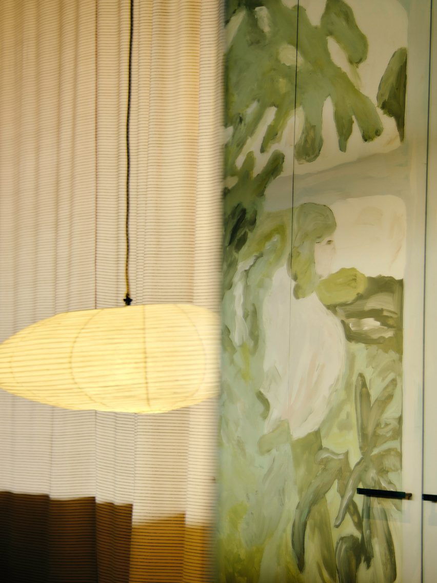 Rice paper lantern and mural of green leafy scene