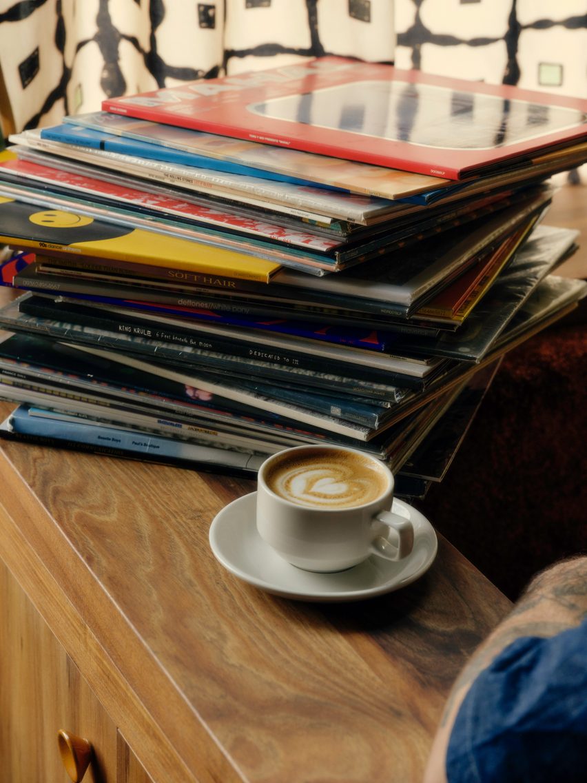 Maple timber joinery with pile of records