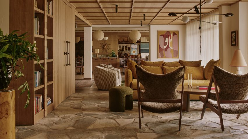 Mid-cenutry modern furniture decorates a space with crazy paving floors
