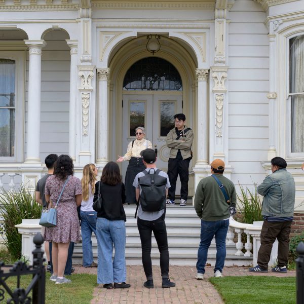 a photograph of people standing outside a building