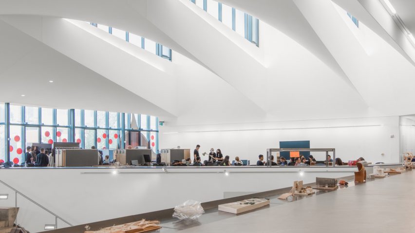 Photograph showing students working in an open plan building.