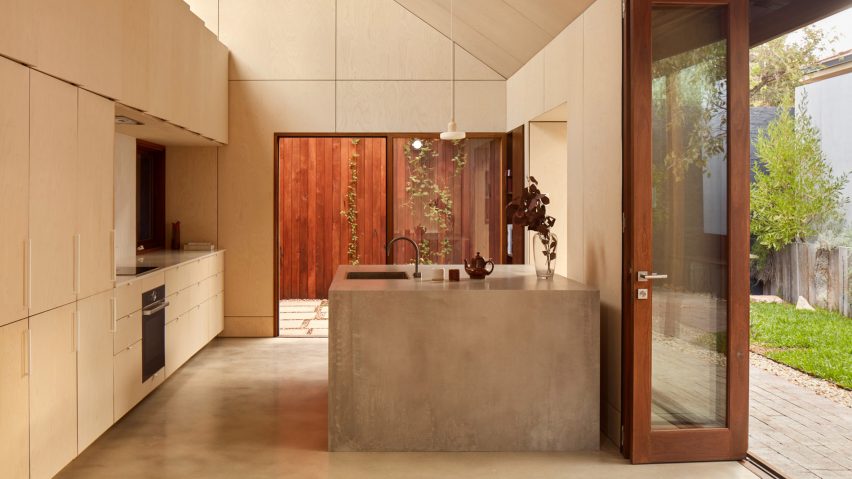 Photo of kitchen with concrete island