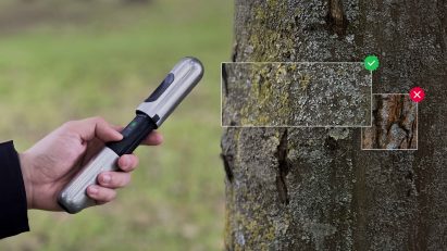 Hanju Seo's EarthCode handheld device scanning tree bark