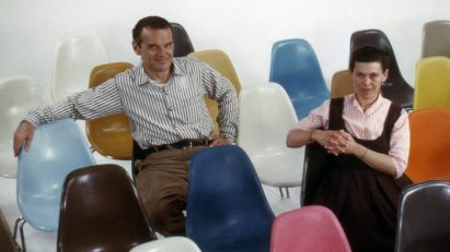 Eameses sitting on fibreglass chairs