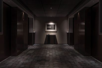 Darkened hallway in a hotel designed by Simplicity