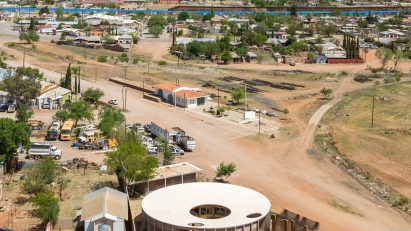 Circular community building in Sonora with city in background
