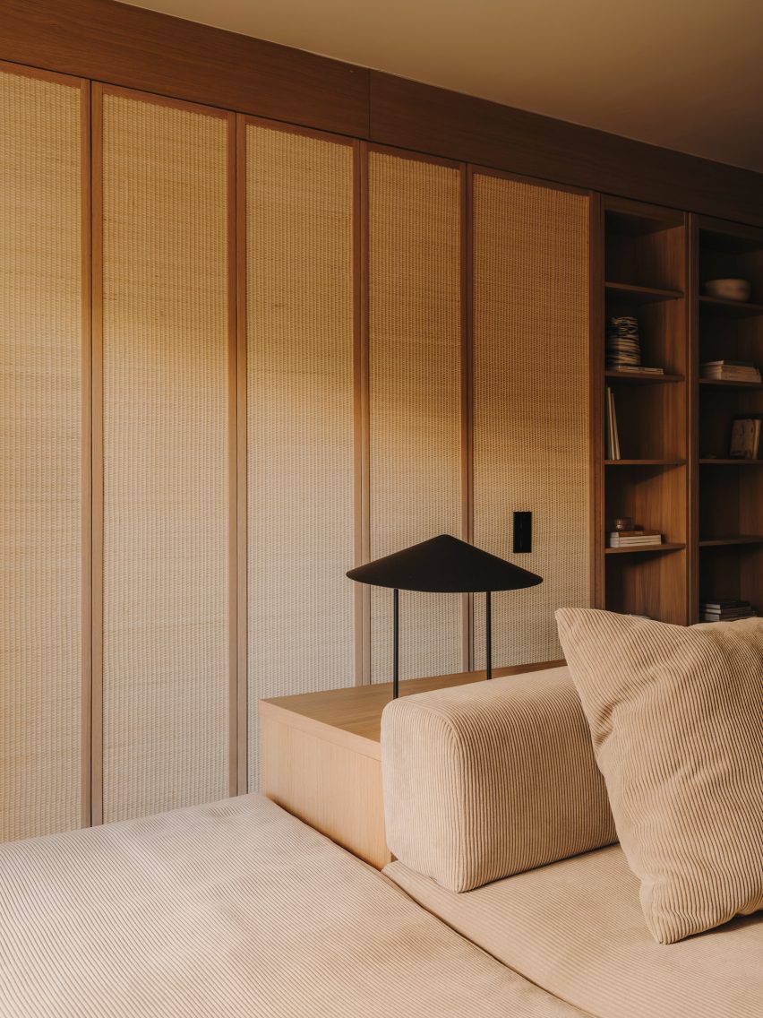 Rattan concertina doors closing off bedroom from living room