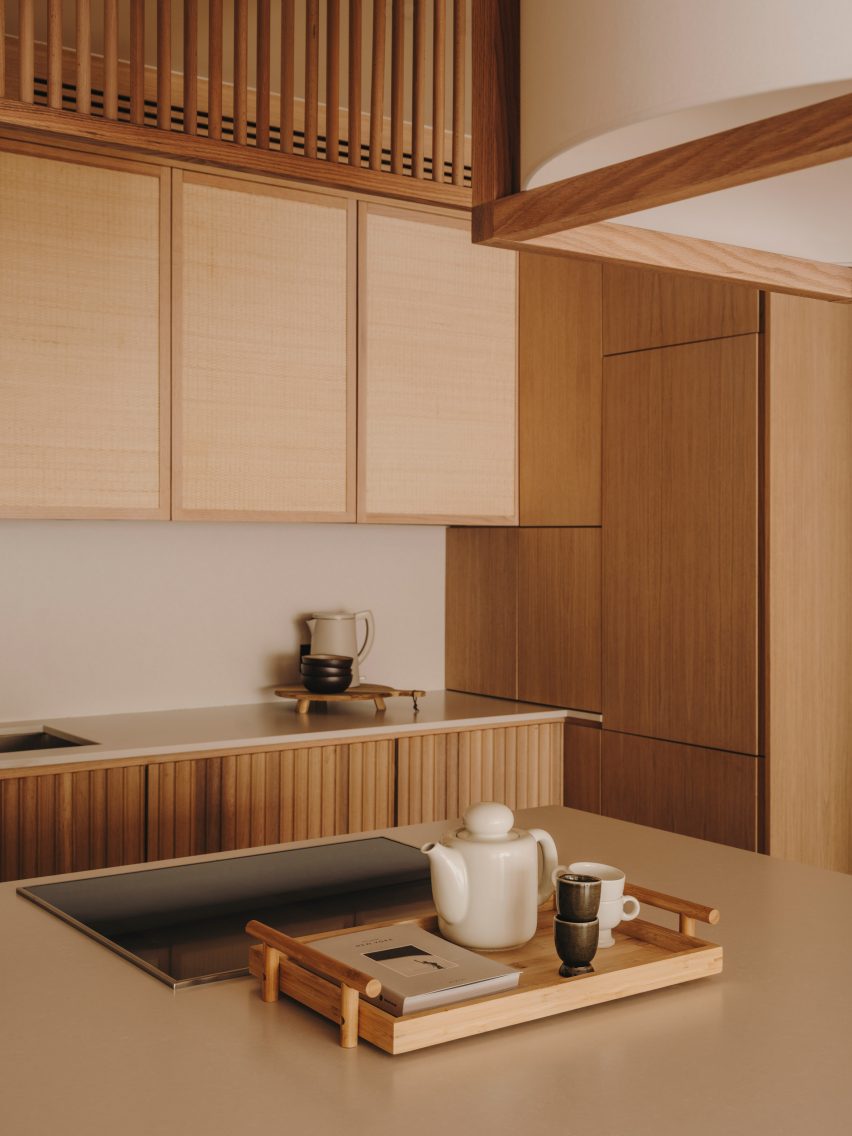 Rattan and wood lined kitchen Miriam Barrio Studio