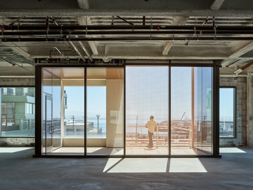 Person looking out over balcony