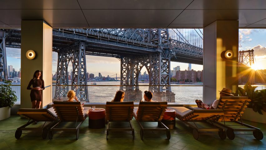 People sitting in chairs overlooking the water