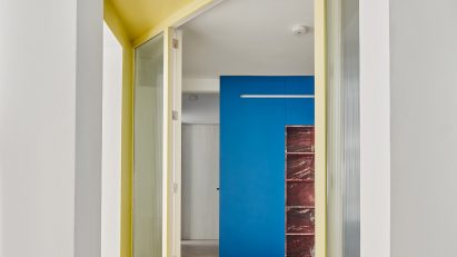 Yellow entranceway by Raúl Sánchez Architects