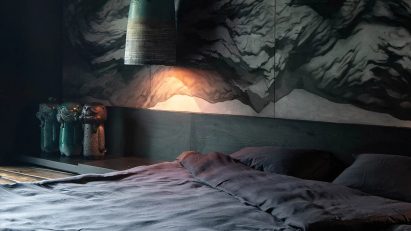 Dark bedroom with green and blue accents