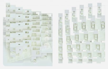A photograph of an architectural model in tones of white and in a rectangular shape.