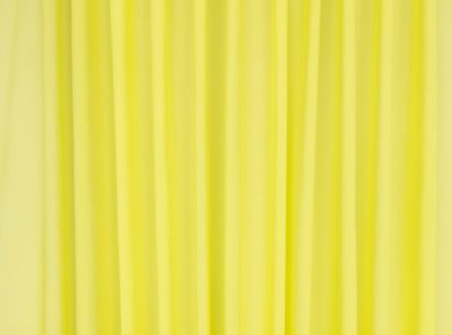 Close-up photo of the Kirkby Design Aloe fabric in a bright acid yellow